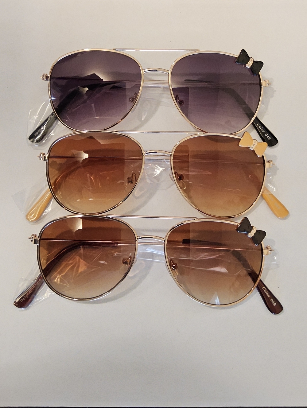C. Women's Aviator Sunglasses with Bow Accent - Brown Gradient